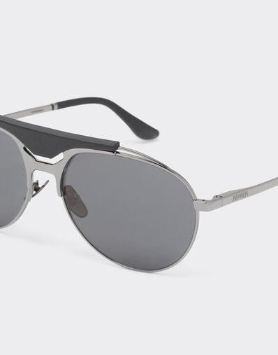 Ferrari Ferrari sunglasses in gunmetal grey metal and leather with blue lenses Ingrid LA02Ff