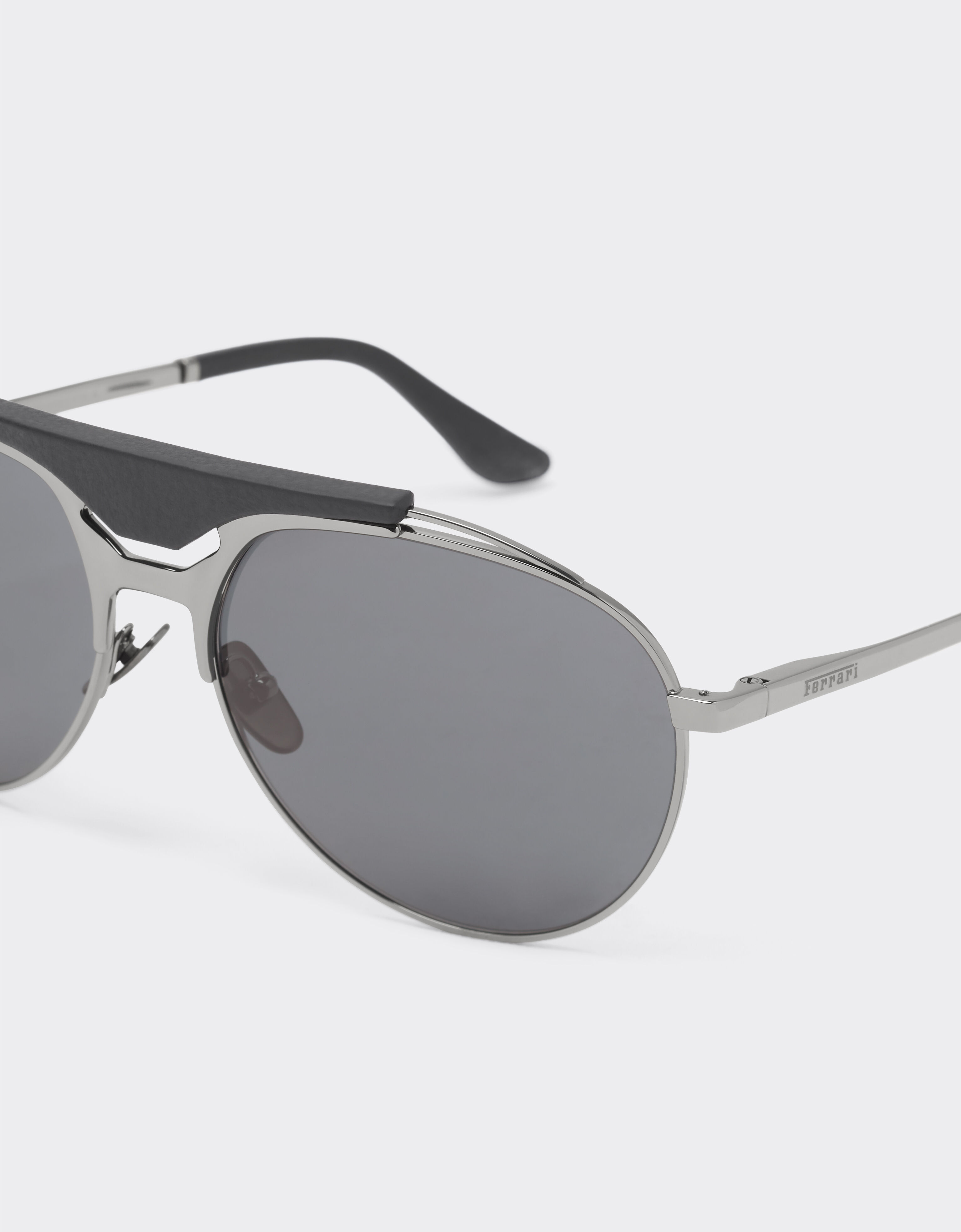 Ferrari Ferrari sunglasses in gunmetal grey metal and leather with blue lenses Ingrid LA02Ff