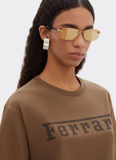 Lunettes de soleil Ferrari en titane doré mat et acétate avec verres jaune doré transparent miroir Ferrari Lunettes de soleil Ferrari en titane doré mat et acétate avec verres jaune doré transparent miroir Oro LA0L9f