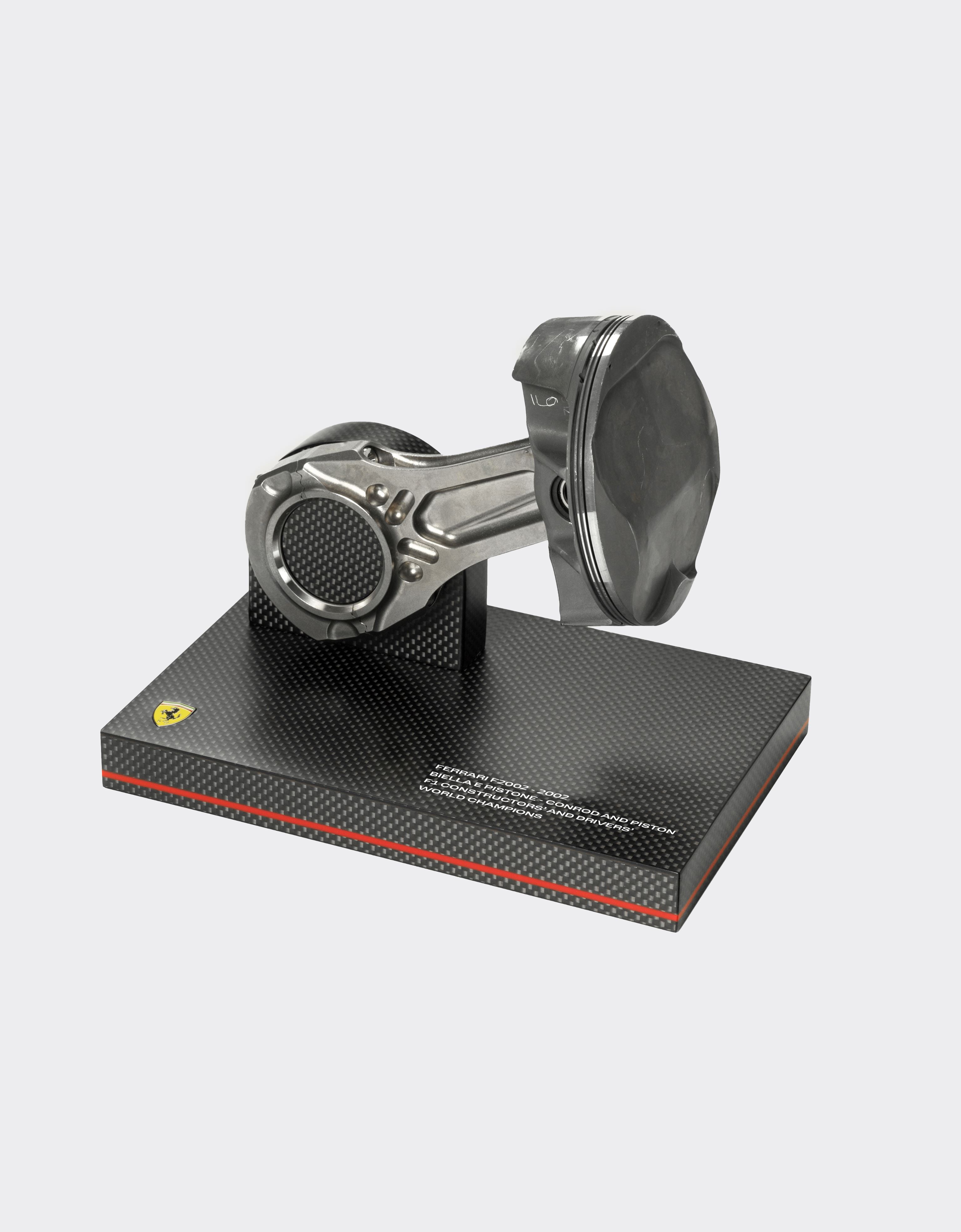 Original connecting rod and piston set from the F2002, winner of